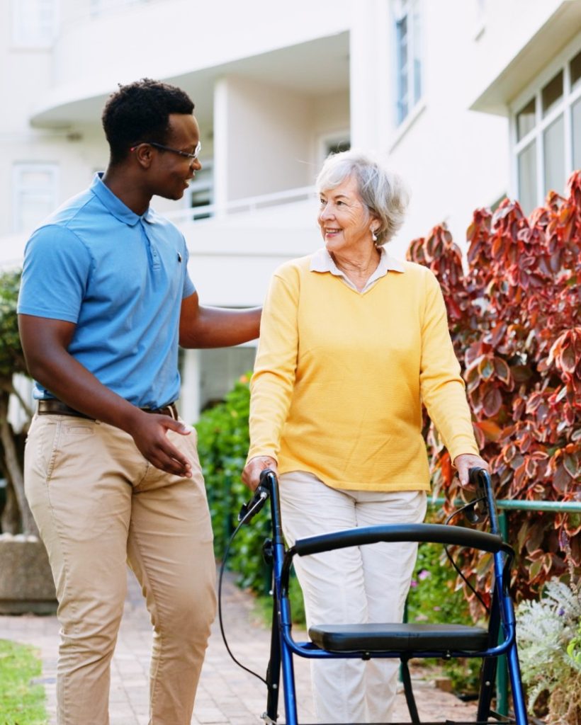 caregiver-outdoor-support-with-old-woman-walker-rehabilitation-healthcare-helping-medical-advice-nurse-with-person-with-disability-nursing-home-elderly-care-trust (Large)