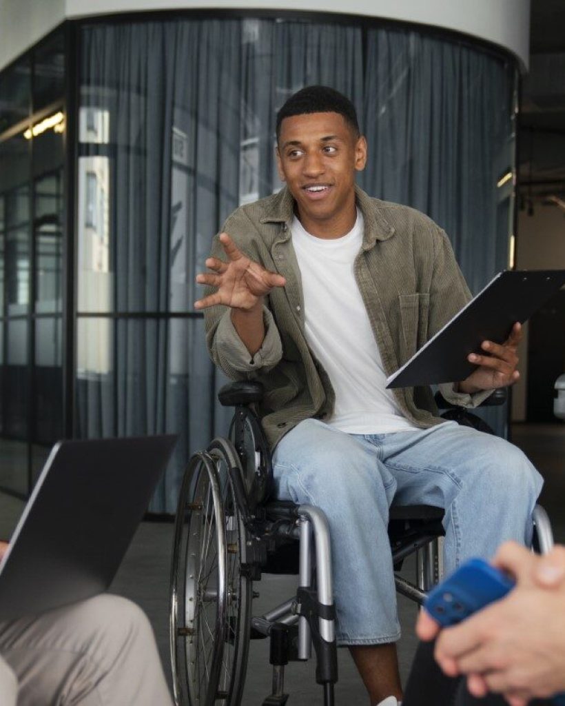 disabled-man-wheelchair-working-his-office-job (Large)