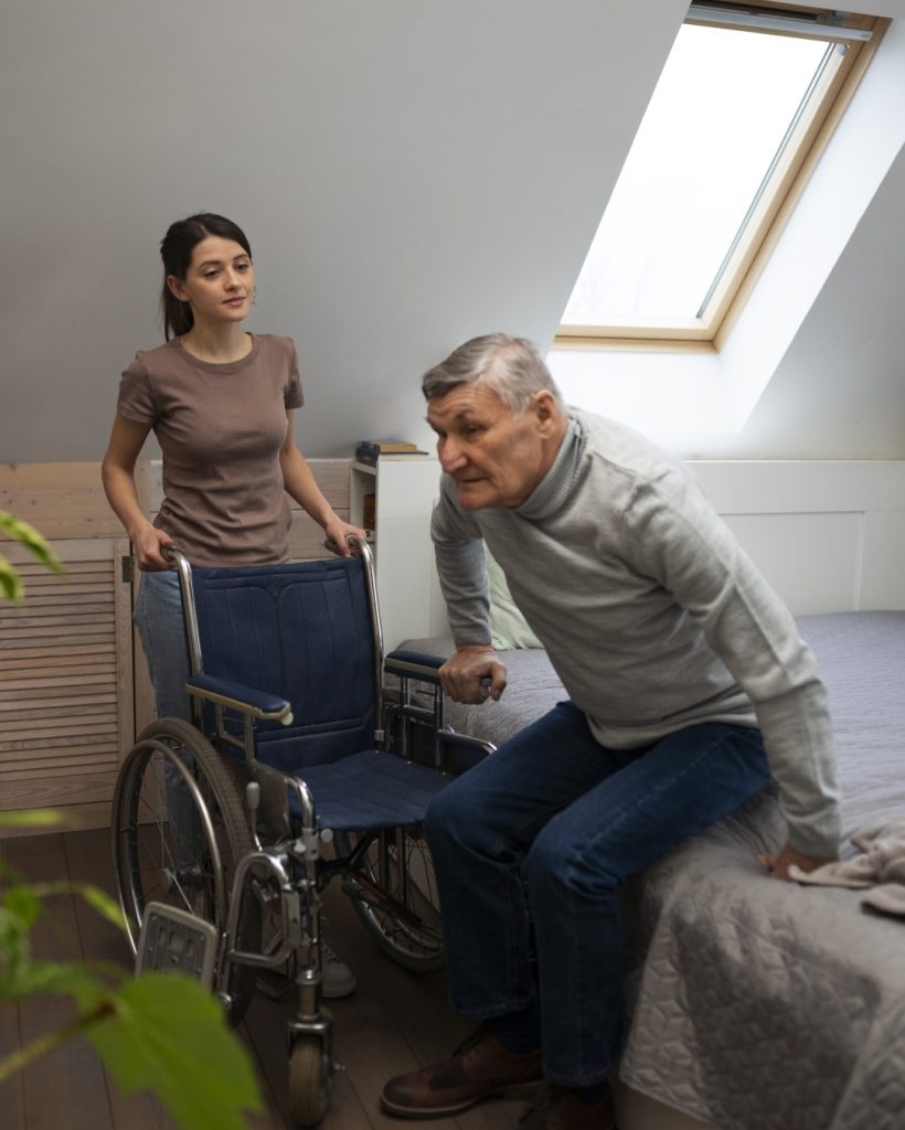 elderly-person-being-taken-care-by-female-caretaker (Large)