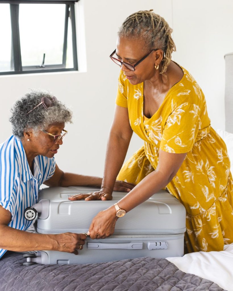 senior-african-american-woman-senior-biracial-woman-are-packing-suitcase-together (Large)